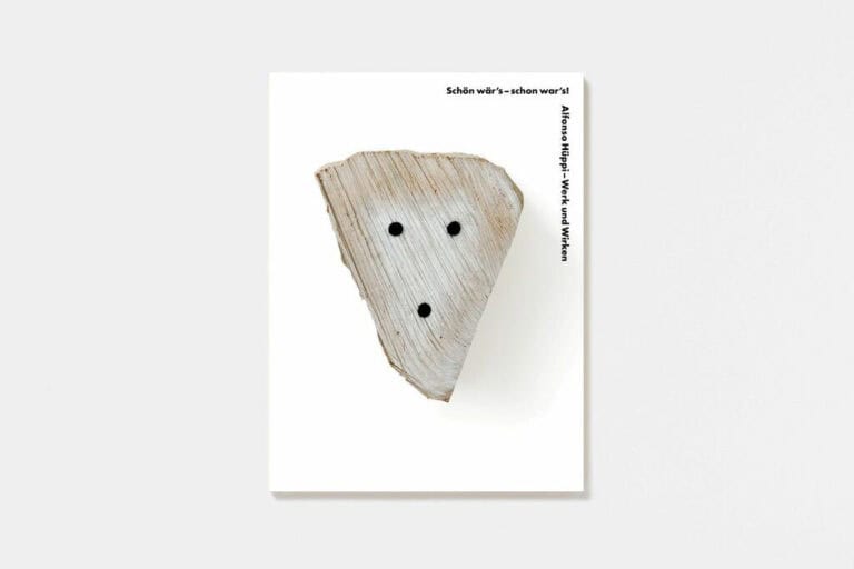 Foto: Cover eines Ausstellungskatalogs. Eine weiße Fläche mit einer Abbildung. In der Linken Ecke schwarze Schrift: " „Schön wär’s - schon war’s! Alfonso Hüppi - Werk und Wirken"